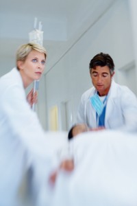 doctors rushing patient